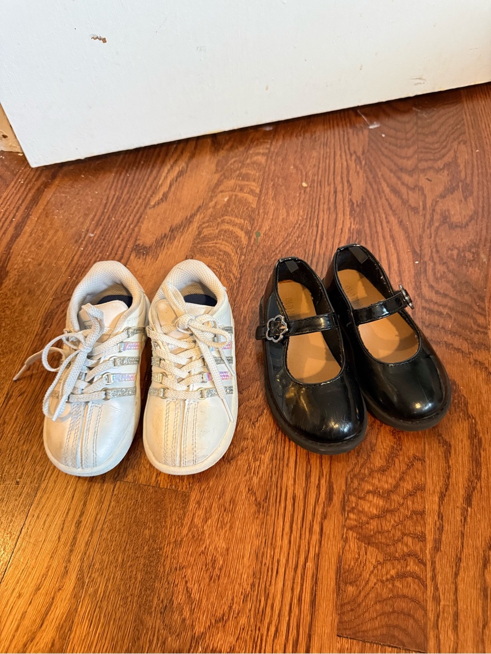 Bundle of toddler shoes: old navy black Mary Jane’s and K Swiss white sneakers